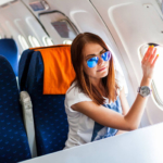 woman looking out of window airplane web 800px
