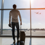 man looking at plane