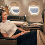 qf-a330-business-female-using-cabin-technology-v3