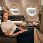qf-a330-business-female-using-cabin-technology-v3