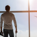 Calm guy looking at flying plane
