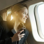 Woman looking out airplane window